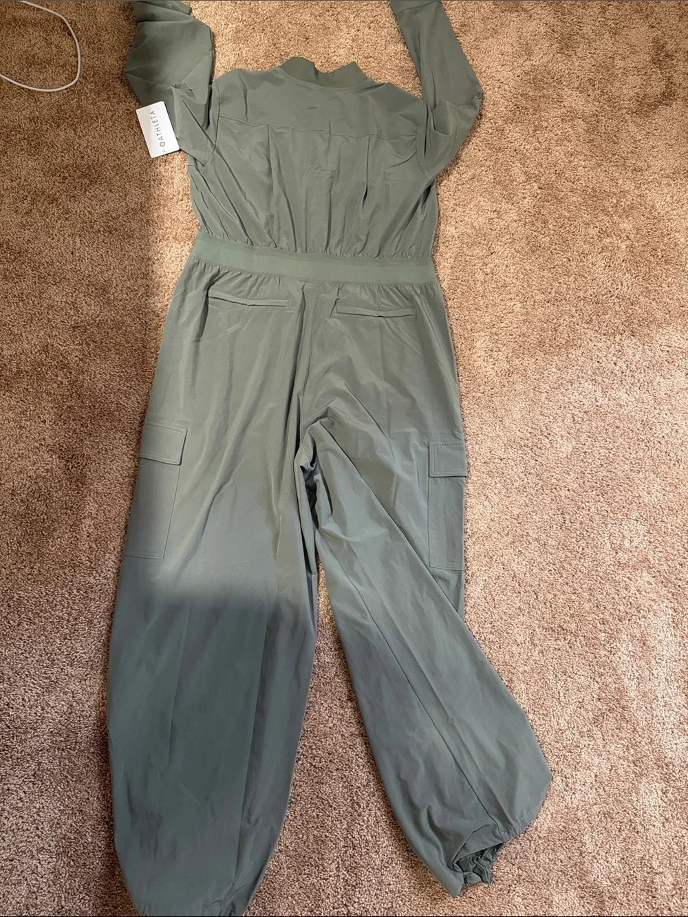 Athleta Brooklyn long sleeve jumpsuit. Size 16 deep green NWT.